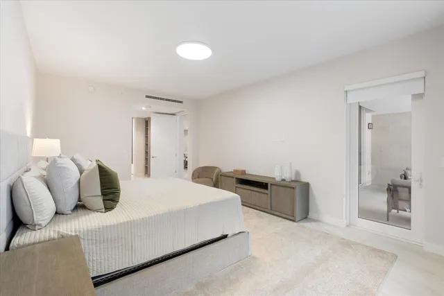 a bedroom with a bed and with furniture