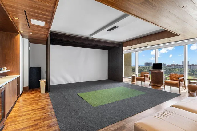 a view of a room with wooden floor and white walls