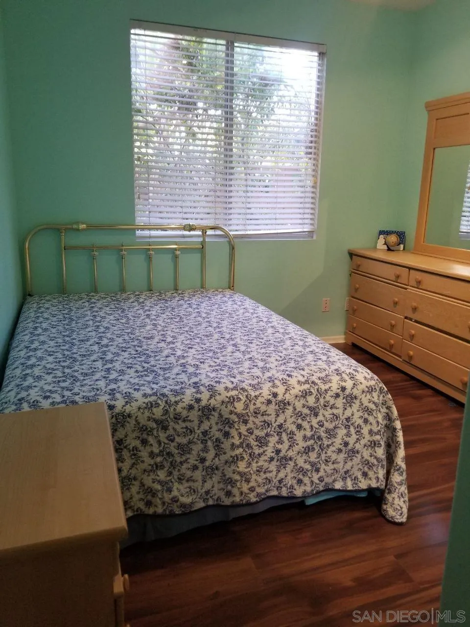 11909 Westview Parkway San Diego, CA 92126 - Photo 7 of 10 a bed sitting in a bedroom next to a window