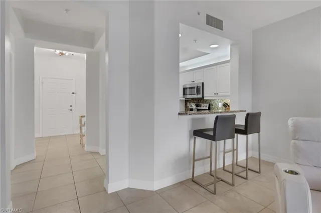 a kitchen with a sink cabinets and appliances