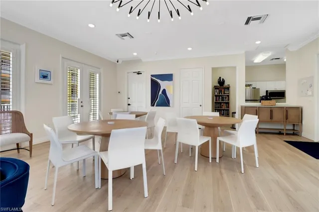 a dining room with furniture a rug and wooden floor