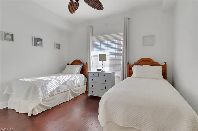 a bedroom with bed and window