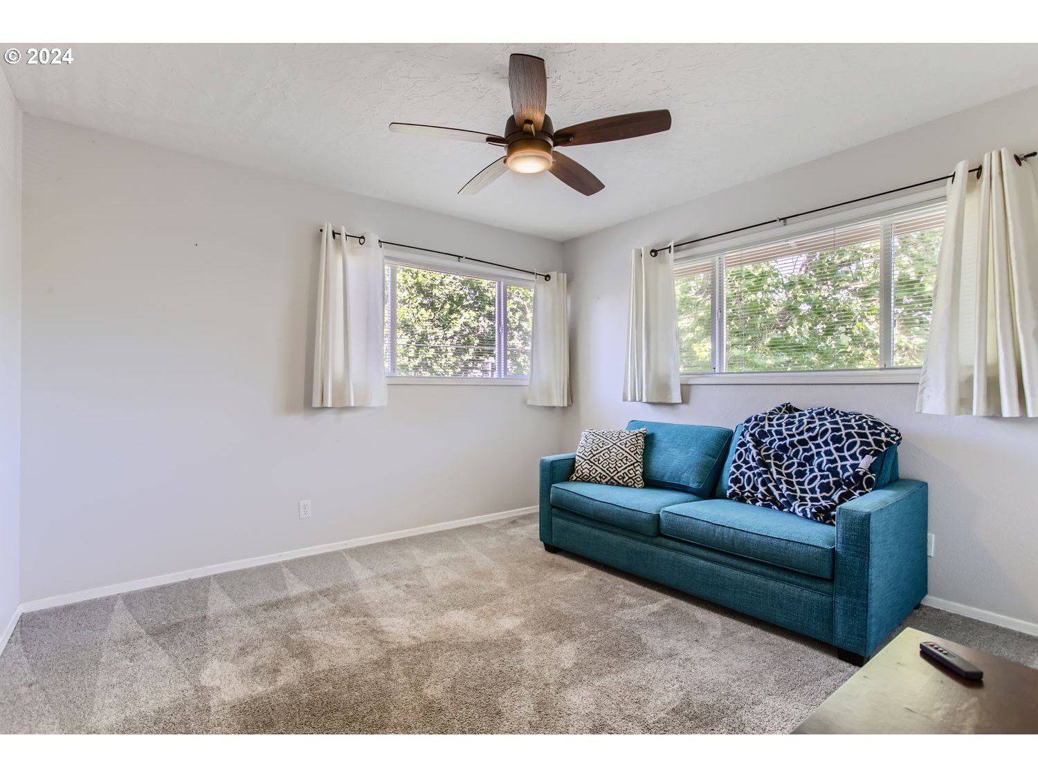 2022 Northeast Clackamas Street Portland, OR 97232 - Photo 11 of 13 a living room with furniture and a large window