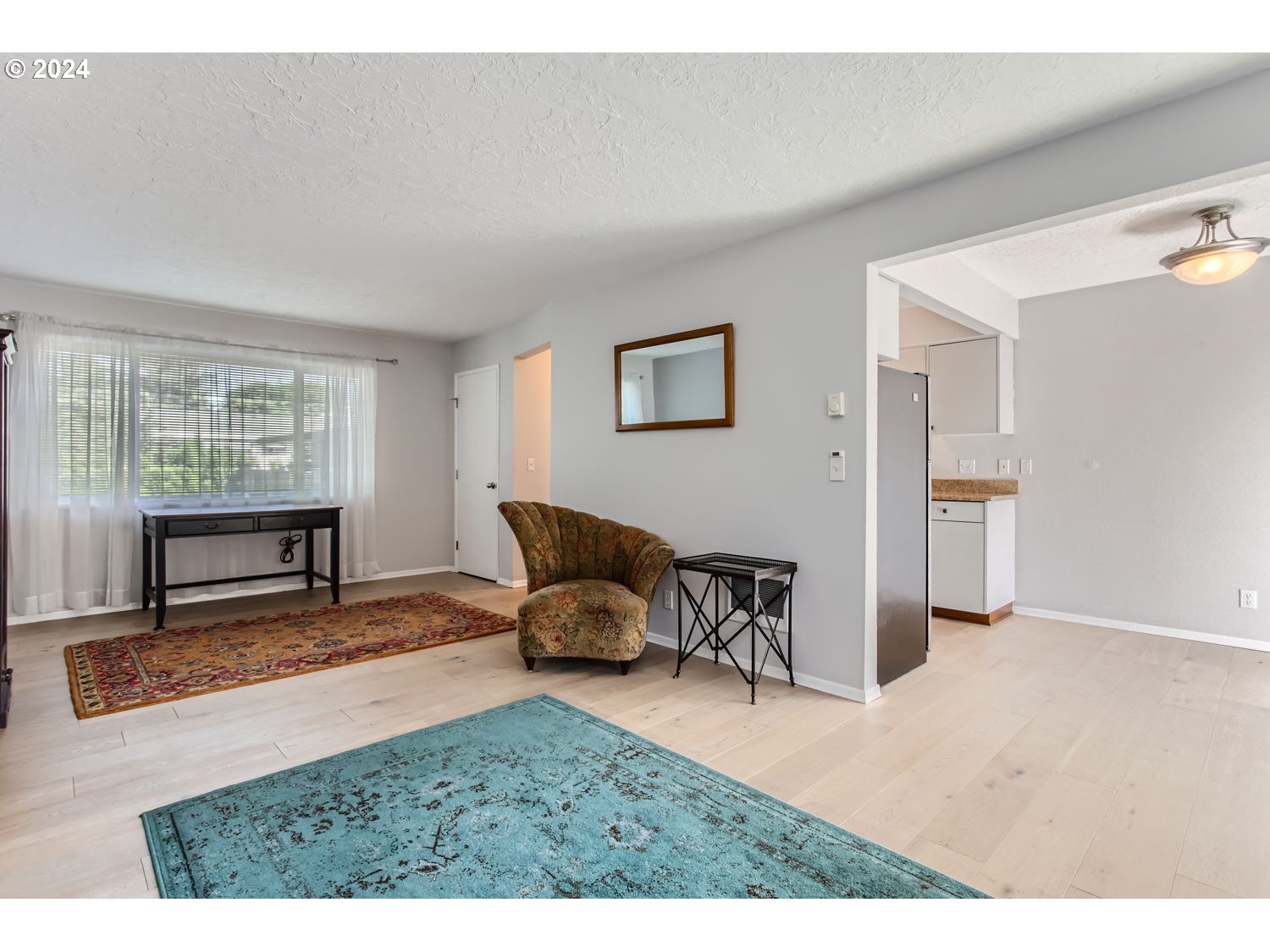 2022 Northeast Clackamas Street Portland, OR 97232 - Photo 4 of 13 a living room with furniture and a table