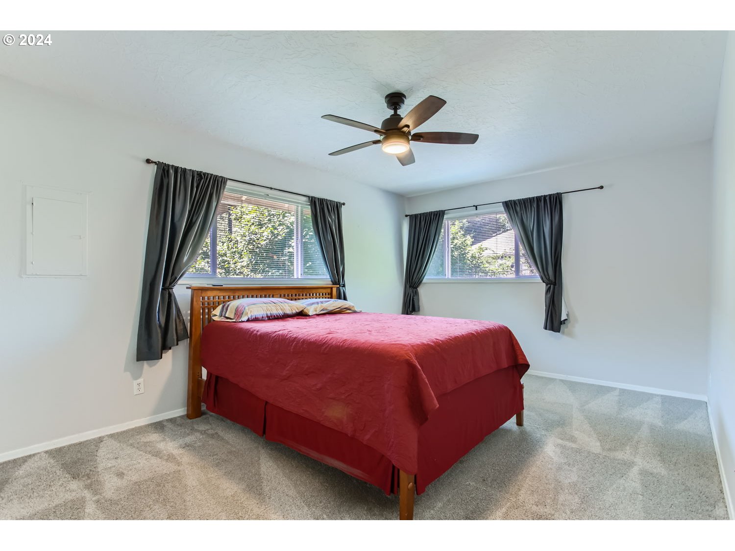 2022 Northeast Clackamas Street Portland, OR 97232 - Photo 8 of 13 a bedroom with a large bed and a large window