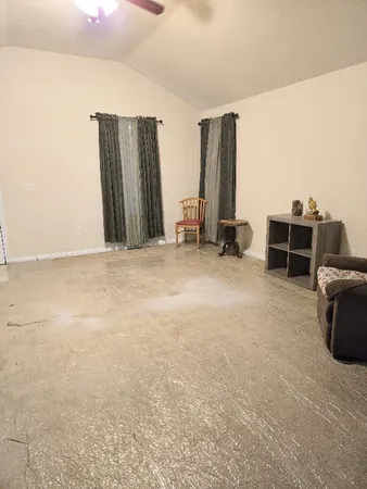 a view of room with furniture and air conditioner vent