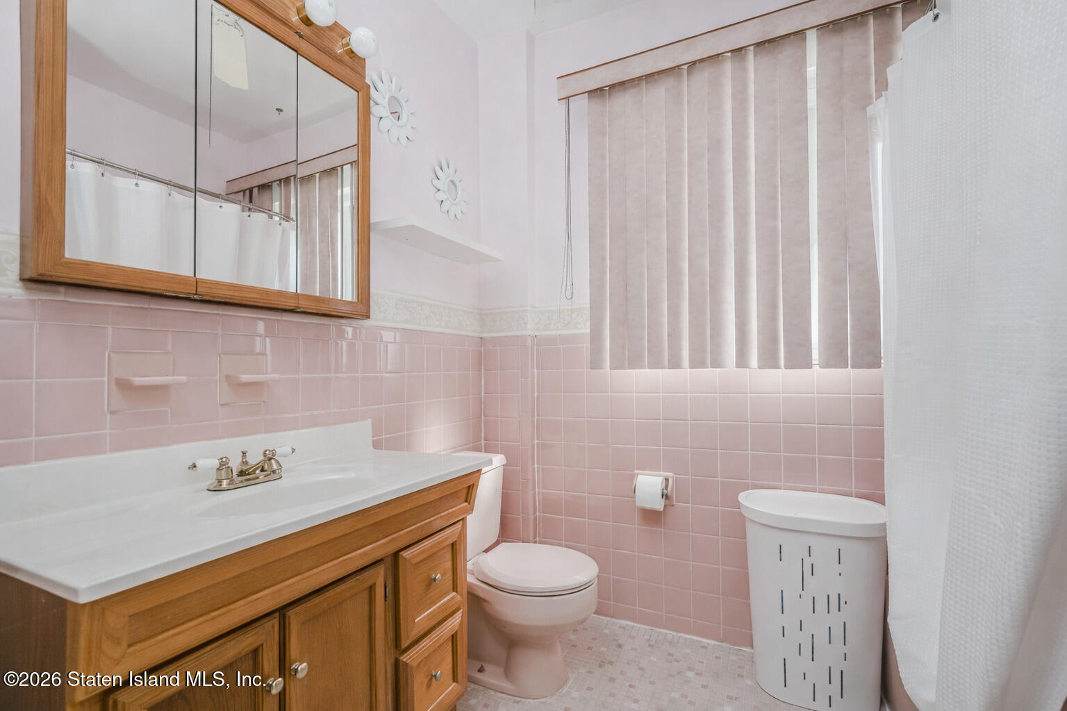 3 3rd Street Staten Island, NY 10306 - Photo 18 of 35 a bathroom with a sink a toilet and shower