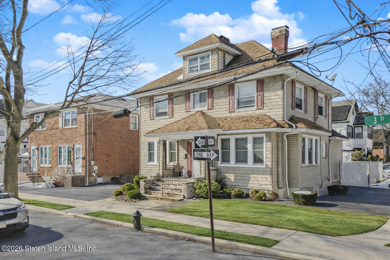 3 3rd Street Staten Island, NY 10306 - Photo 2 of 35 a front view of a house with a yard