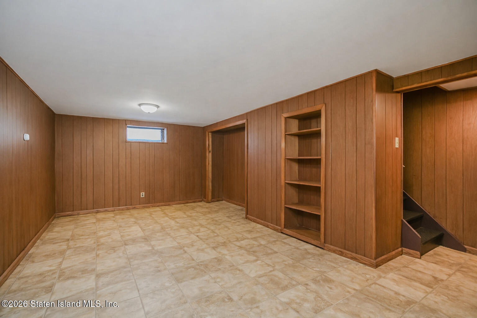 3 3rd Street Staten Island, NY 10306 - Photo 21 of 35 a view of an empty room with a cabinet and mirrors