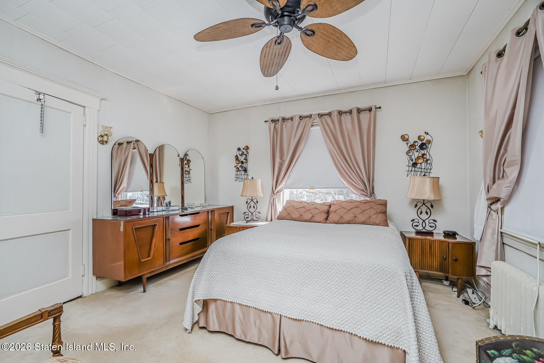 3 3rd Street Staten Island, NY 10306 - Photo 27 of 35 a bedroom with a bed and a chandelier