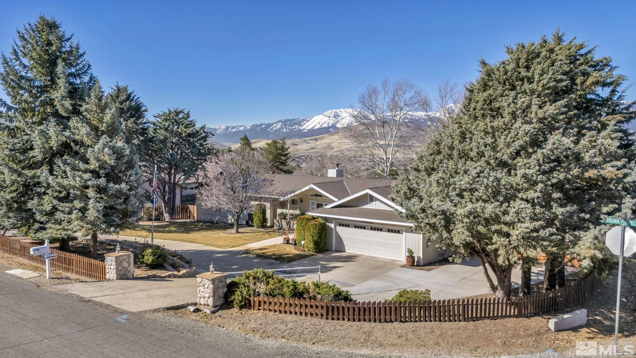 14435 Virginia Foothills Drive Reno, NV 89521 - Photo 1 of 40 a view of a house with a yard