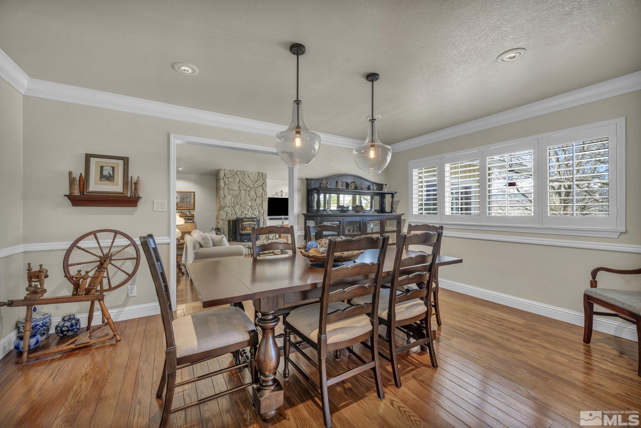 14435 Virginia Foothills Drive Reno, NV 89521 - Photo 12 of 40 a view of a dining room with furniture window and wooden floor