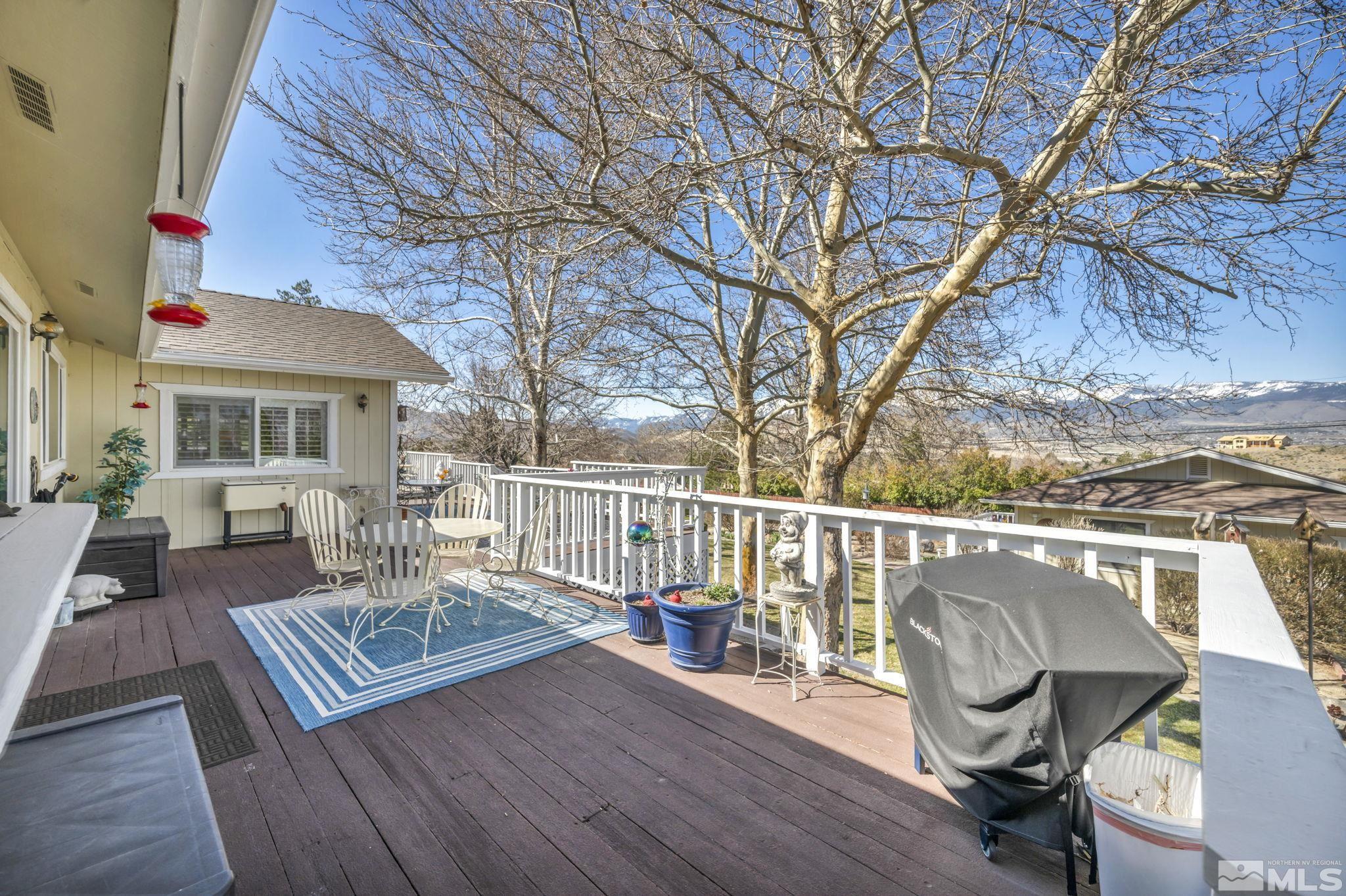 14435 Virginia Foothills Drive Reno, NV 89521 - Photo 28 of 40 a view of a chair and tables in the balcony