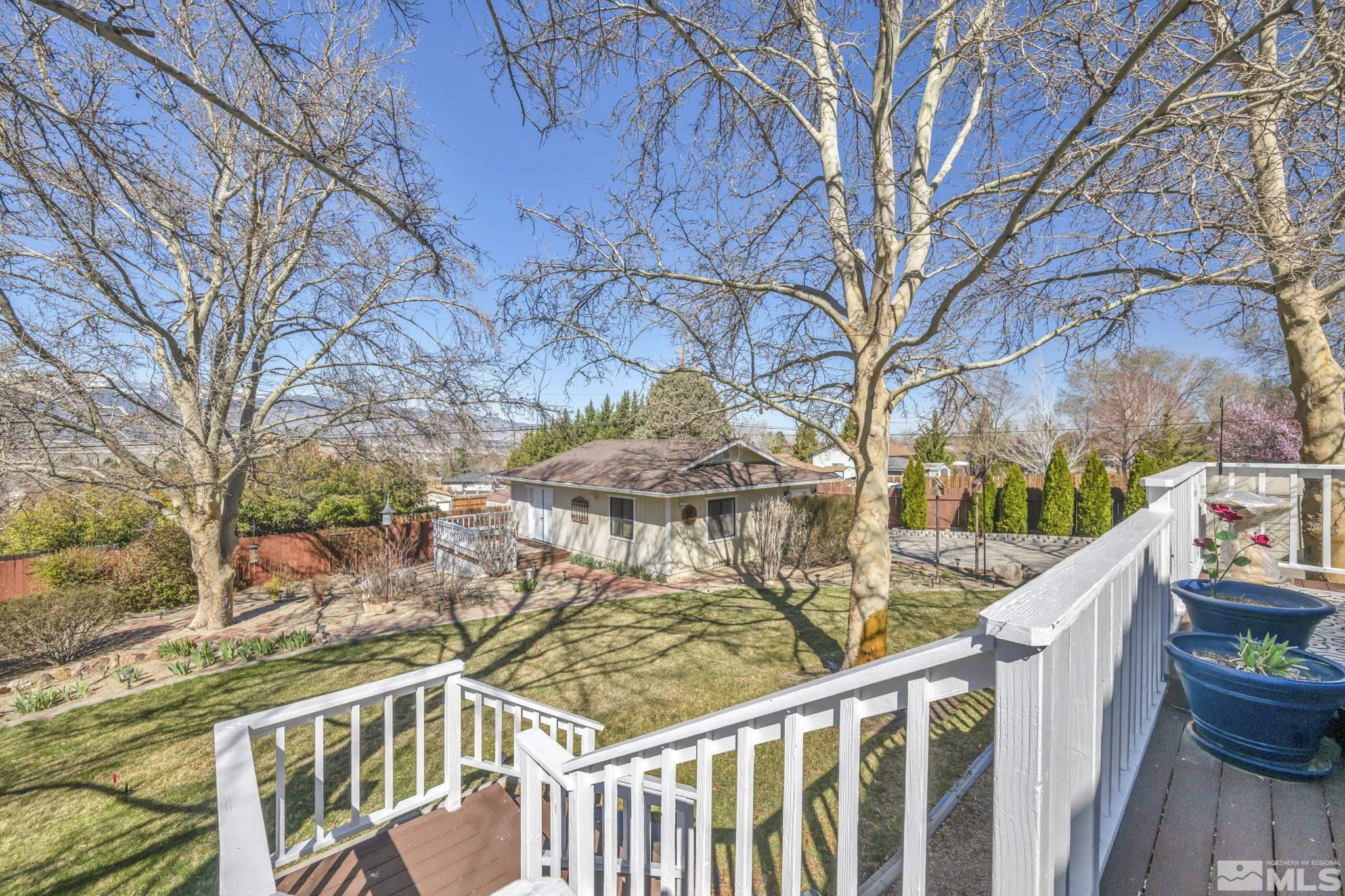 14435 Virginia Foothills Drive Reno, NV 89521 - Photo 29 of 40 a view of a balcony with wooden fence and floor