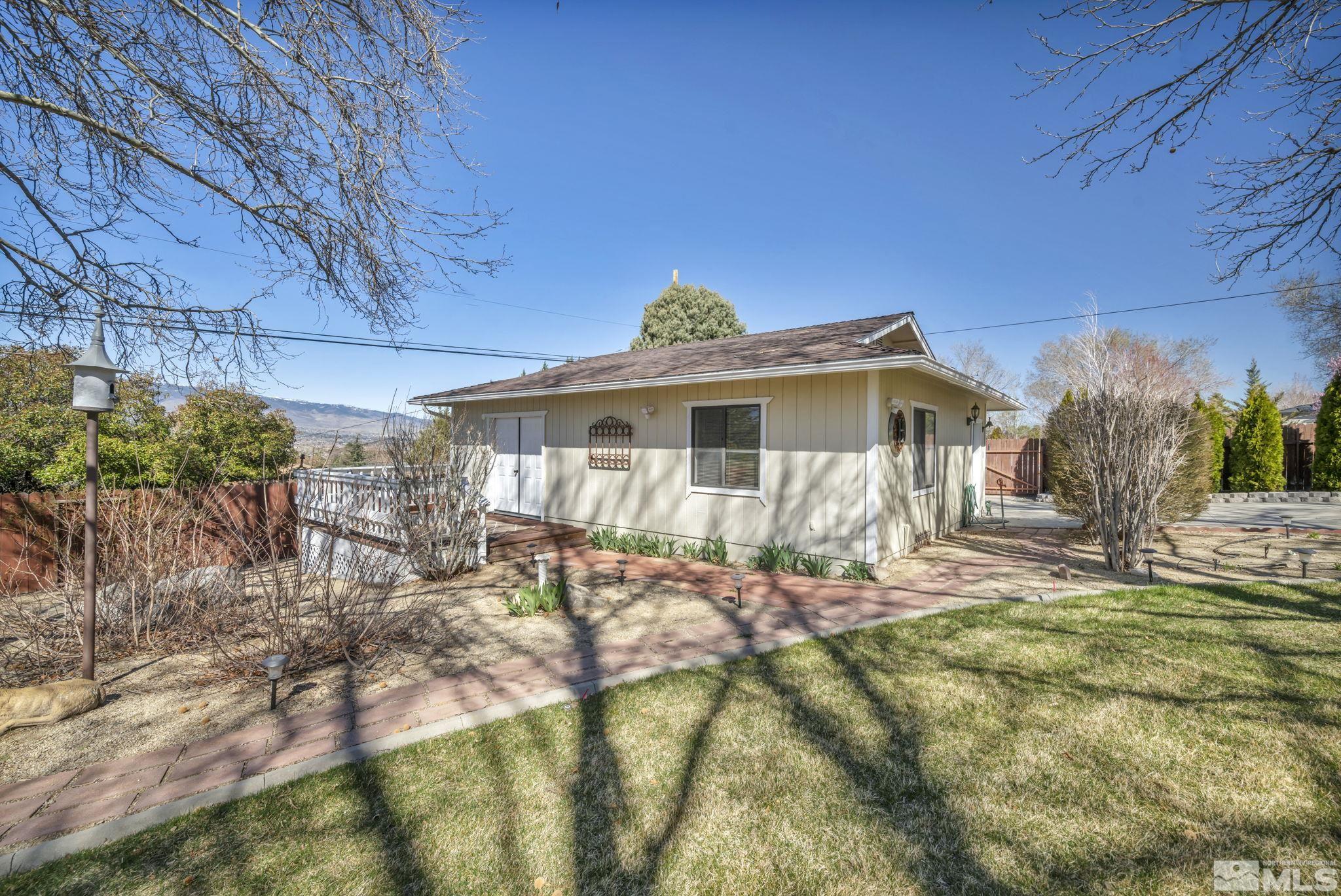 14435 Virginia Foothills Drive Reno, NV 89521 - Photo 34 of 40 a view of a house with backyard and sitting area