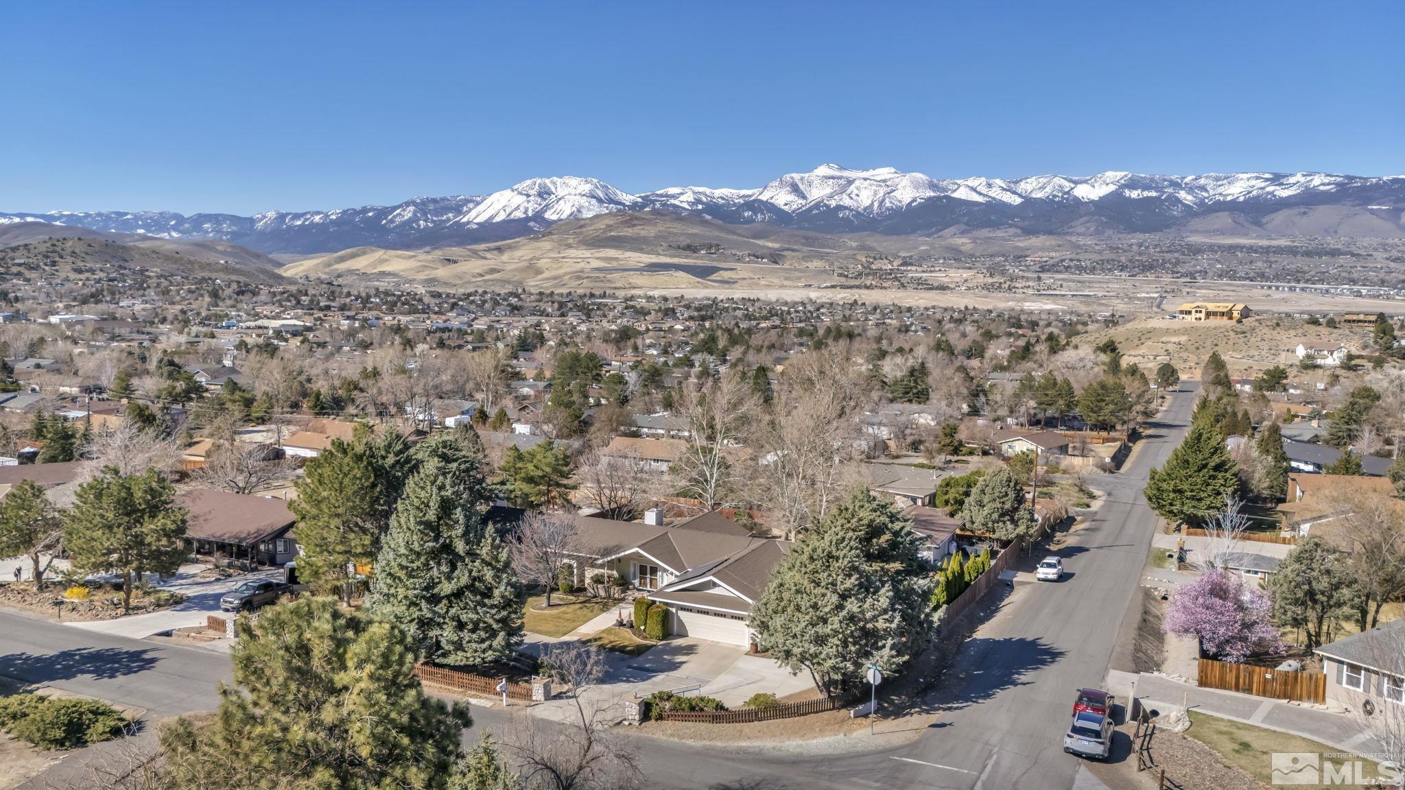 14435 Virginia Foothills Drive Reno, NV 89521 - Photo 4 of 40 a view of a city with mountains in the background