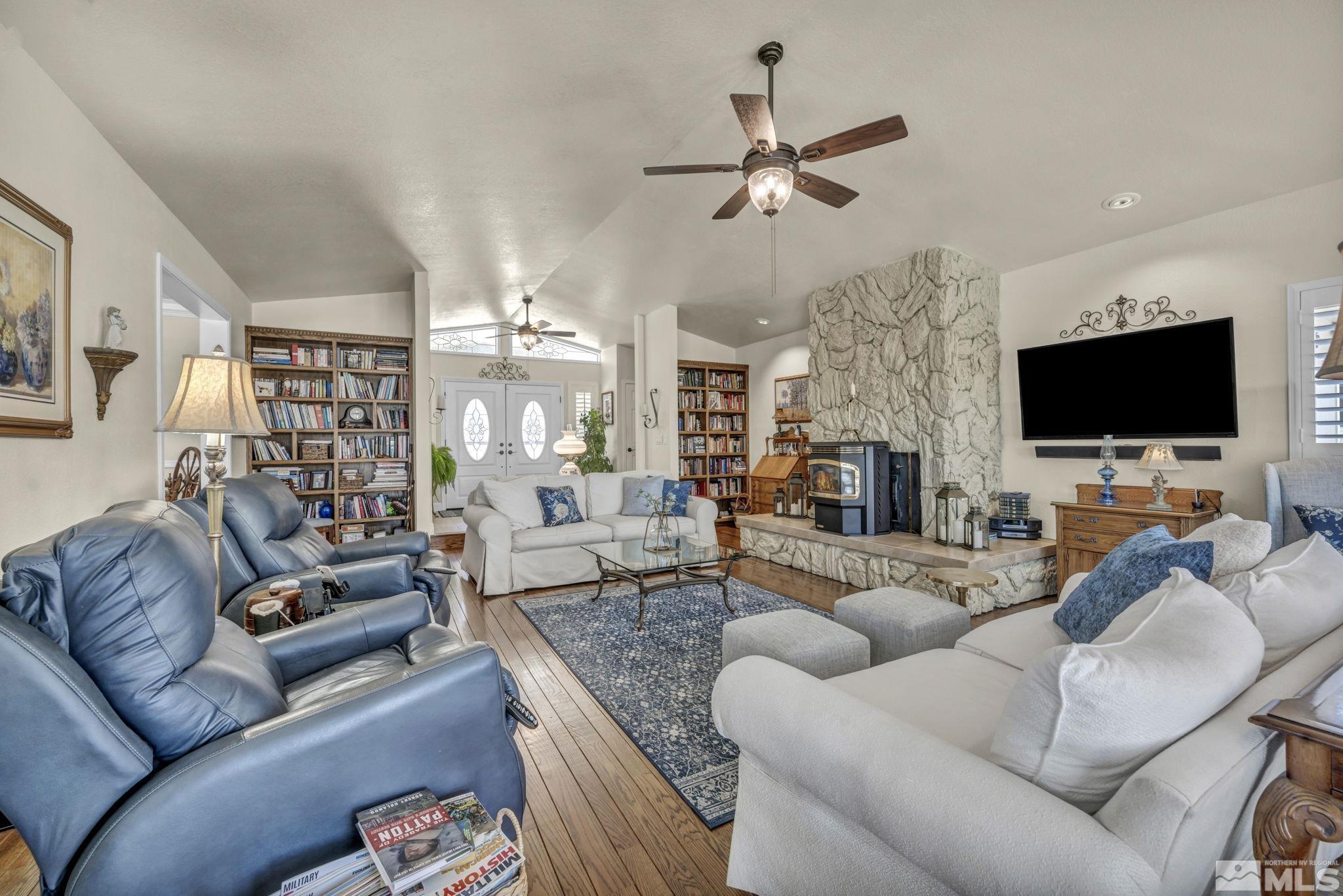 14435 Virginia Foothills Drive Reno, NV 89521 - Photo 8 of 40 a living room with furniture and a flat screen tv