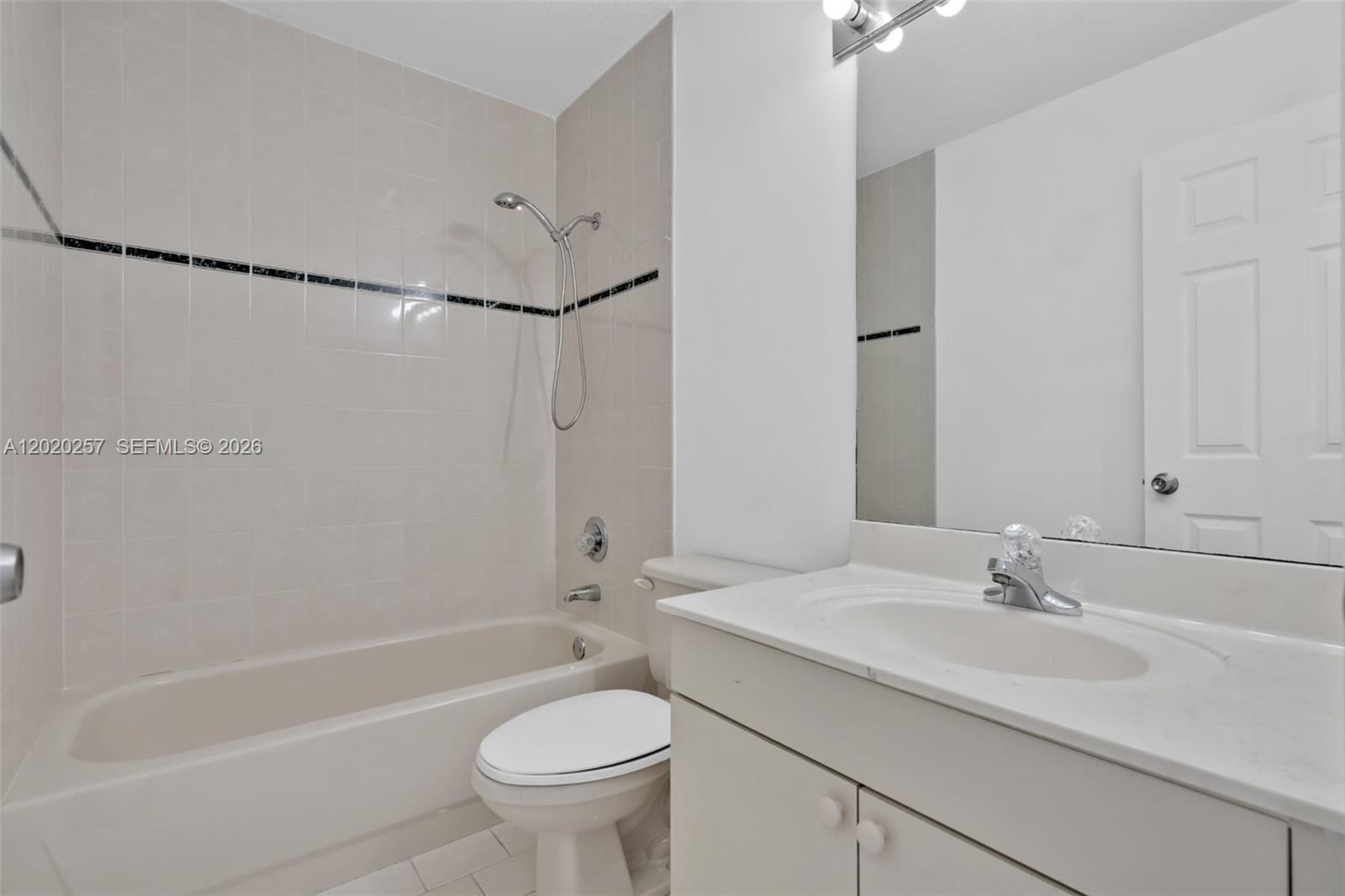 10245 Southwest 154th Place, Unit 1123 Miami, FL 33196 - Photo 15 of 38 a bathroom with a sink toilet and shower