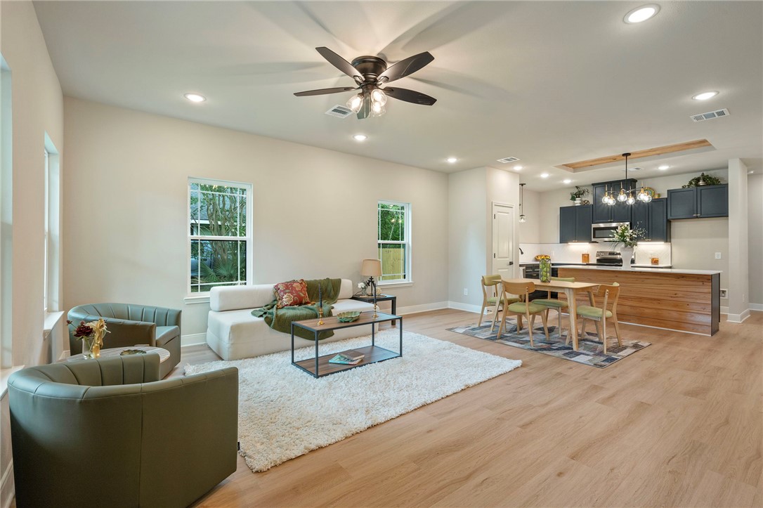 804 East 27th Street Bryan, TX 77803 - Photo 9 of 21 a living room with furniture and kitchen view
