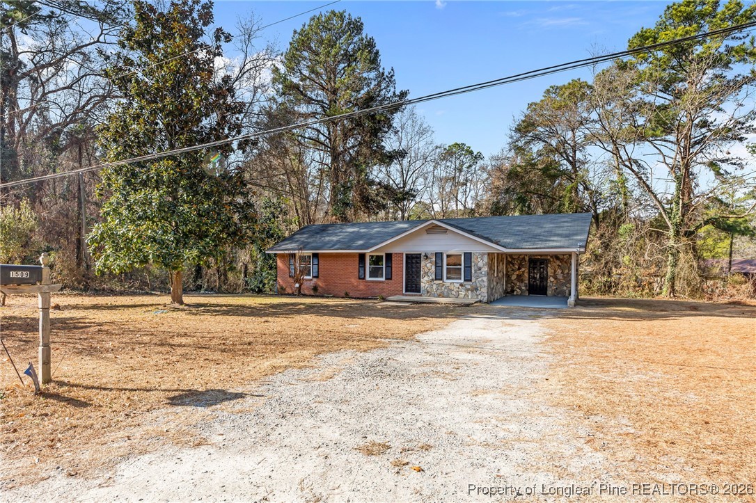 1509 Pope Street Raeford, NC 28376 - Photo 2 of 30 a view of a house with a yard