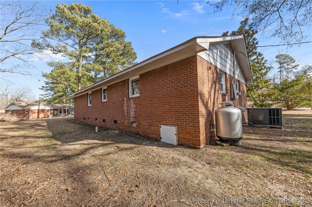 1509 Pope Street Raeford, NC 28376 - Photo 25 of 30 a backyard of a house with table and chairs