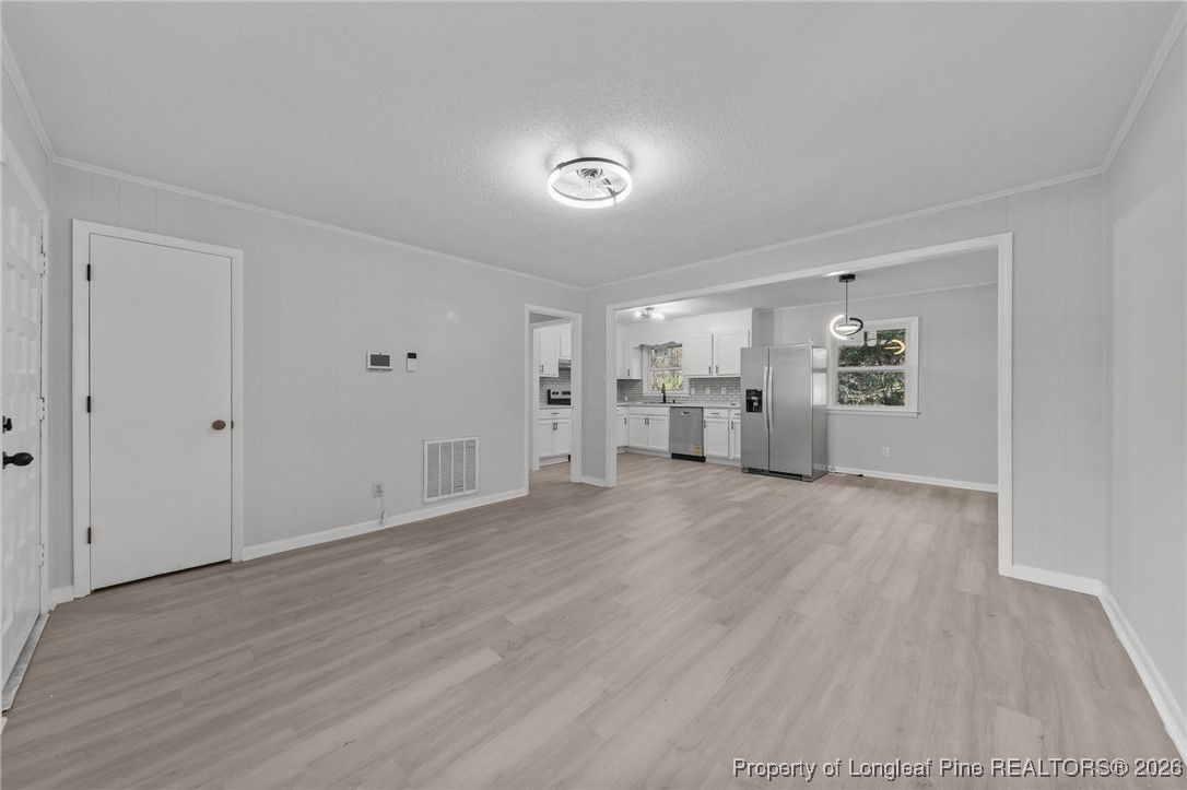 1509 Pope Street Raeford, NC 28376 - Photo 8 of 30 a view of empty room with wooden floor