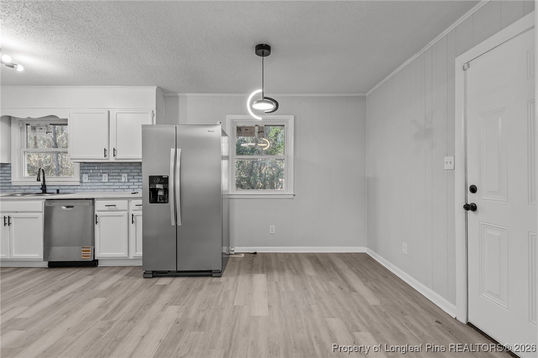 1509 Pope Street Raeford, NC 28376 - Photo 10 of 30 a kitchen with stainless steel appliances a refrigerator sink and stove