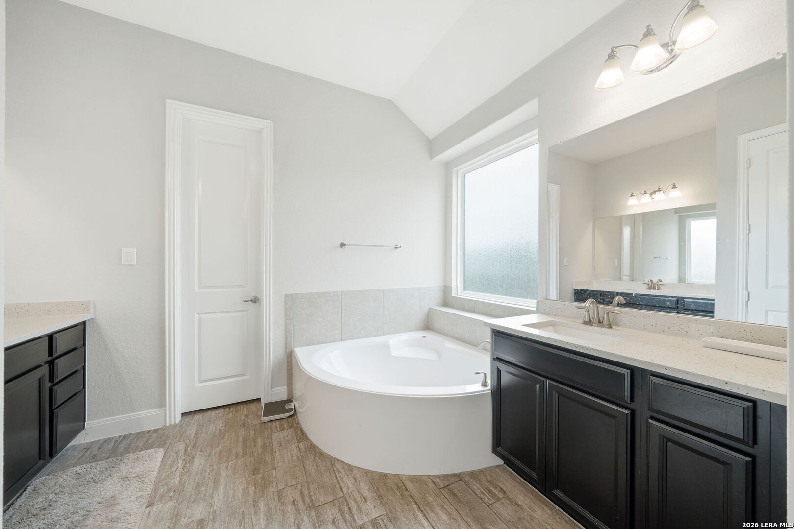 32103 Mirasol Bend Bulverde, TX 78163 - Photo 14 of 23 a bathroom with a sink and a mirror