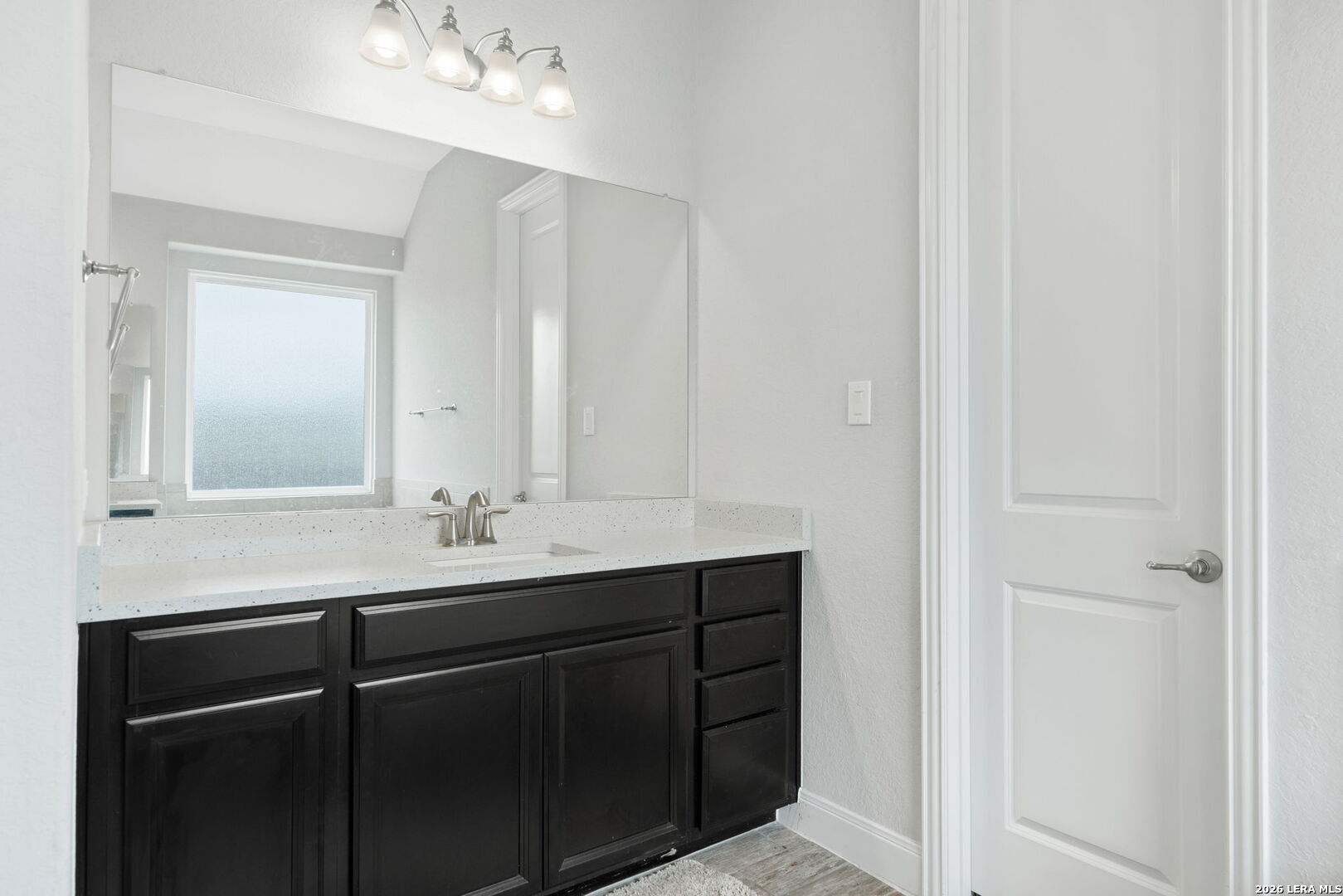 32103 Mirasol Bend Bulverde, TX 78163 - Photo 16 of 23 a bathroom with a sink and a mirror