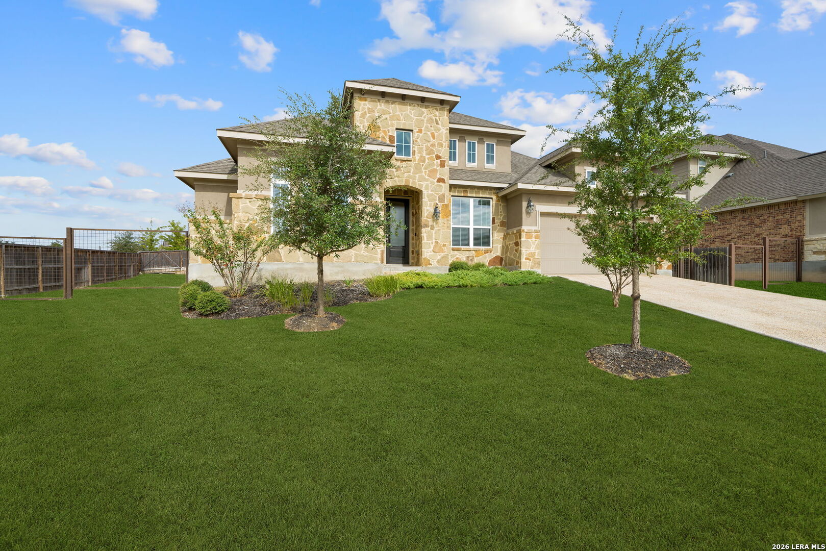 32103 Mirasol Bend Bulverde, TX 78163 - Photo 2 of 23 a front view of a house with a yard