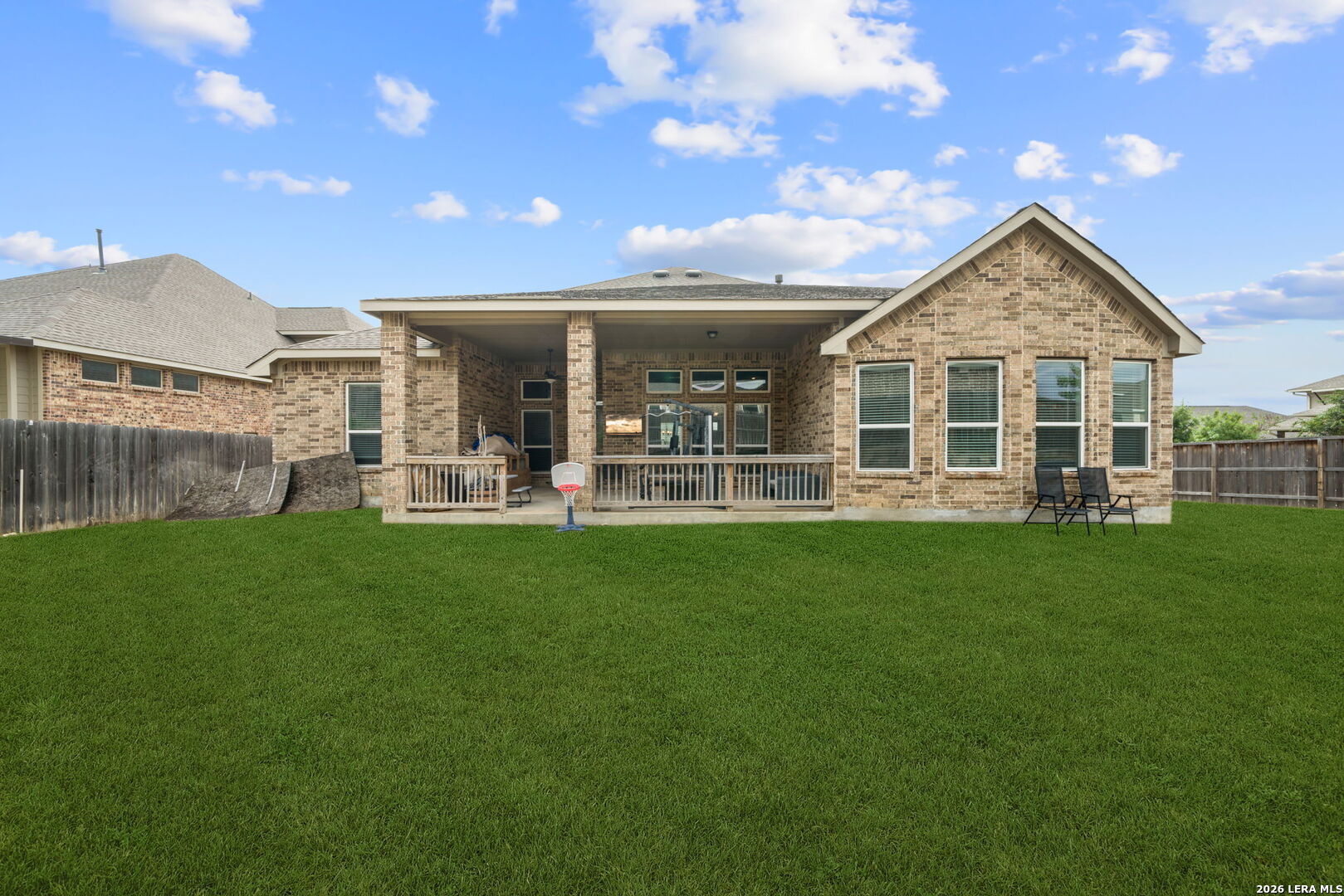 32103 Mirasol Bend Bulverde, TX 78163 - Photo 23 of 23 a view of a house with a backyard and porch