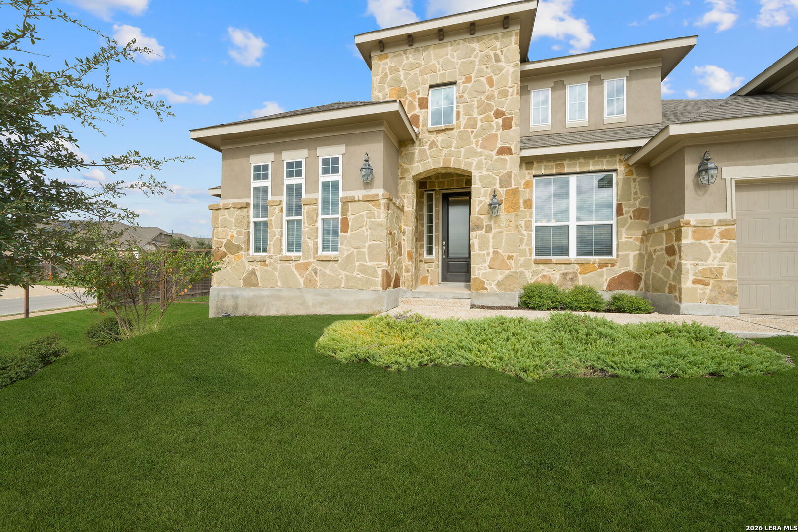 32103 Mirasol Bend Bulverde, TX 78163 - Photo 3 of 23 front view of a house with a yard