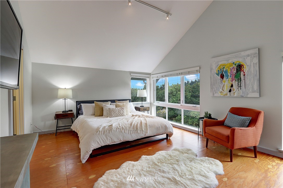 2771 59th Avenue Southwest Seattle, WA 98116 - Photo 9 of 23 a bedroom with a bed and a couch
