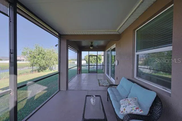 a view of a lake with houses in the background
