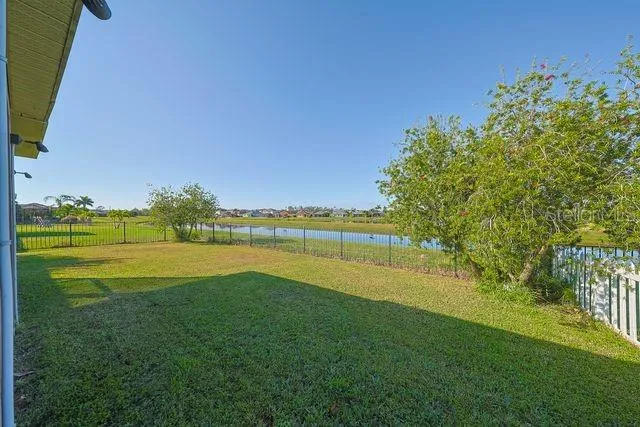 an aerial view of a house with a lake view