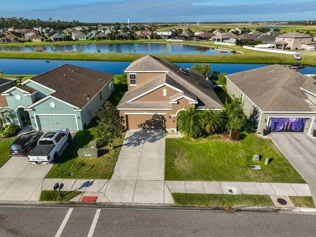 an aerial view of residential houses with outdoor space