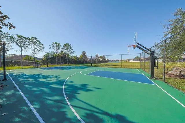 a front view of a house with a yard and potted plants