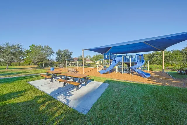 a view of a backyard with sitting area