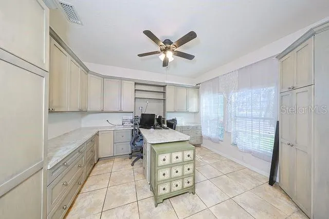 a kitchen with a cabinets and window