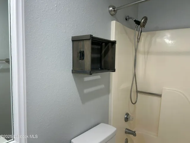 a bathroom that has a shower toilet and sink