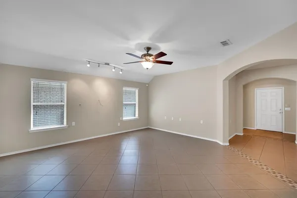 a view of an empty room with a window