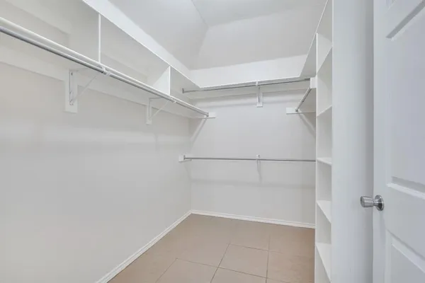 a bathroom with a shower and a sink