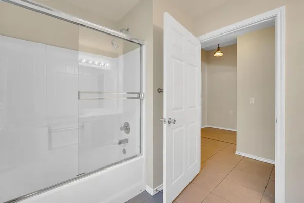 a spacious bathroom with a double vanity sink a toilet and a window