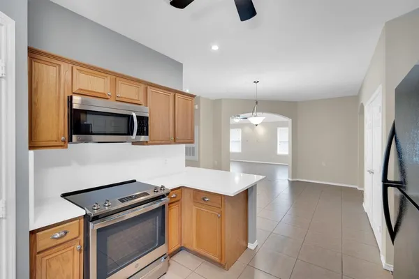 a kitchen with a refrigerator and a sink