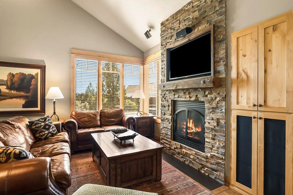 16845 South W Brasada Ranch Road, Unit 23 Powell Butte, OR 97753 - Photo 22 of 47 a living room with furniture a fireplace and a flat screen tv
