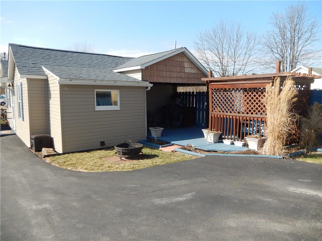 333 Bridgeport Road Mount Pleasant, PA 15666 - Photo 15 of 20 Private patio area with cable and electric, once held a hot tub. Entertain by the fire pit and great paved driveway