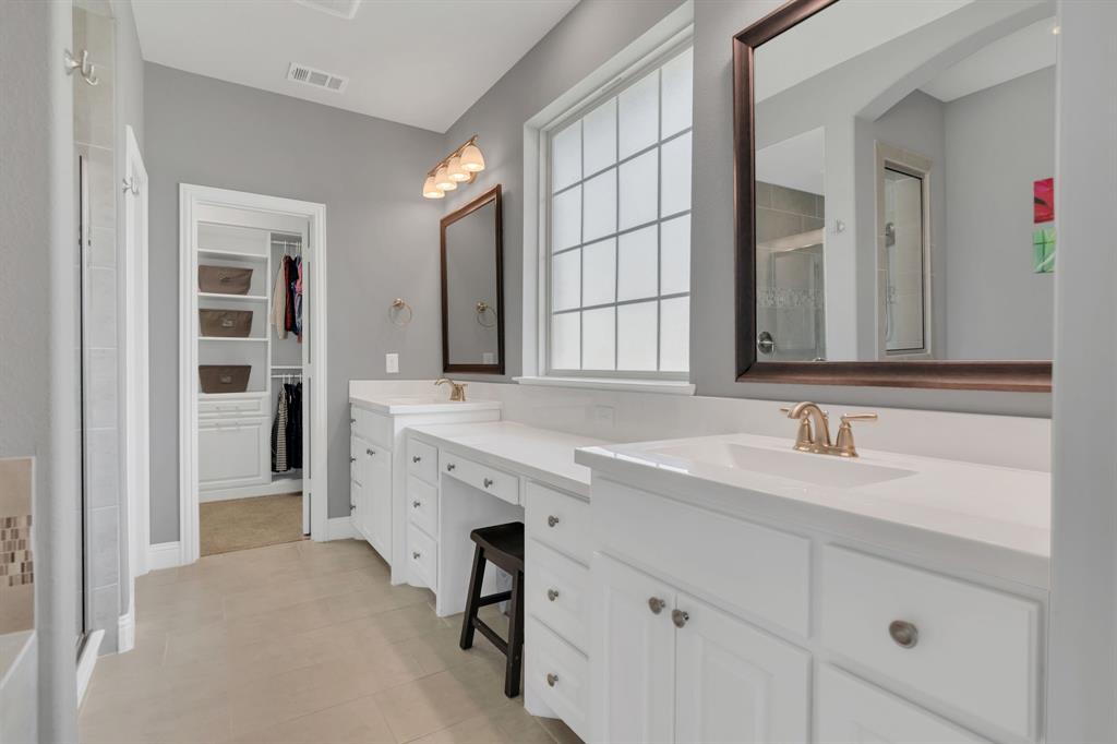 1920 Crescent Street Fort Worth, TX 76008 - Photo 17 of 40 a bathroom with a sink and a mirror