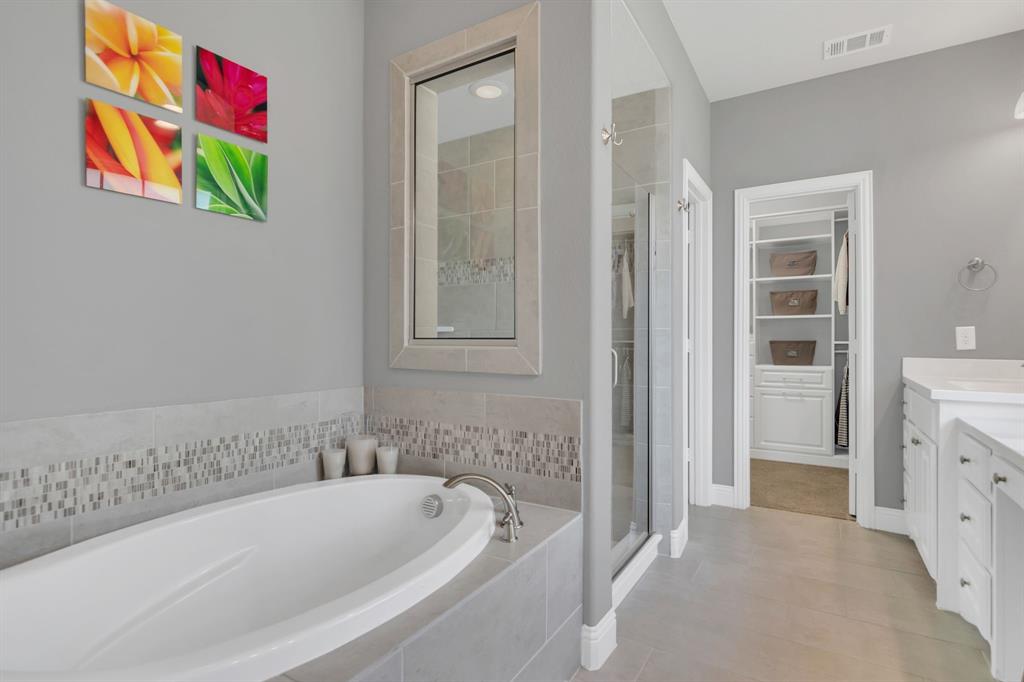 1920 Crescent Street Fort Worth, TX 76008 - Photo 18 of 40 a spacious bathroom with a bathtub and a shower