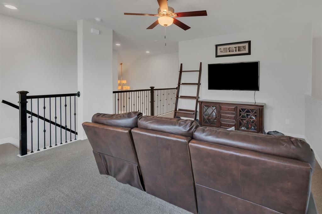 1920 Crescent Street Fort Worth, TX 76008 - Photo 27 of 40 a living room with furniture and a flat screen tv