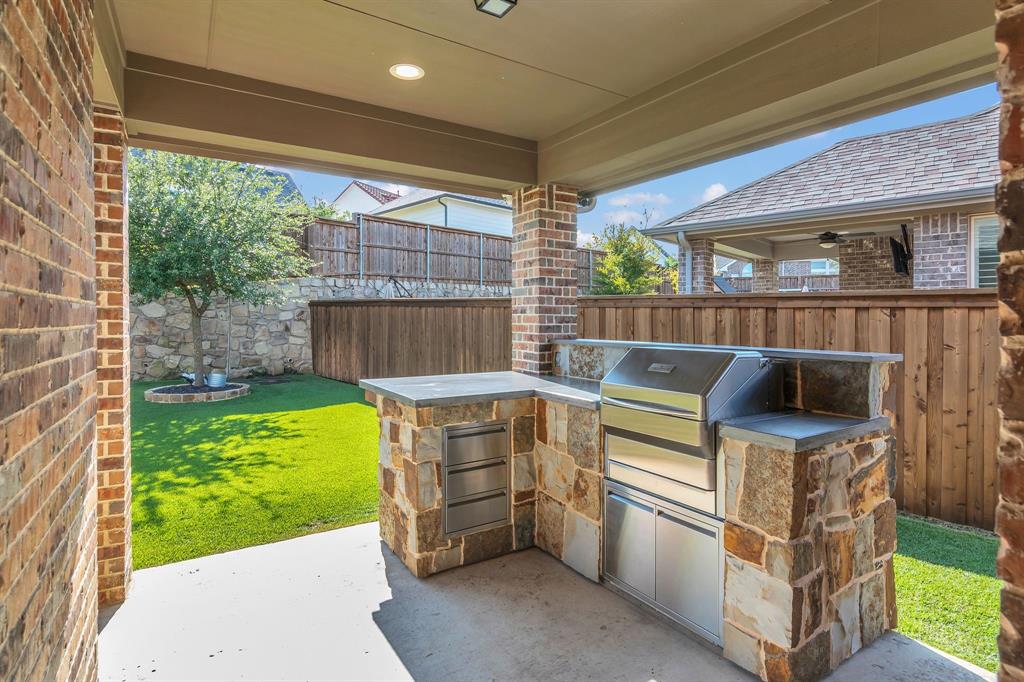 1920 Crescent Street Fort Worth, TX 76008 - Photo 31 of 40 a kitchen with a stove and a sink